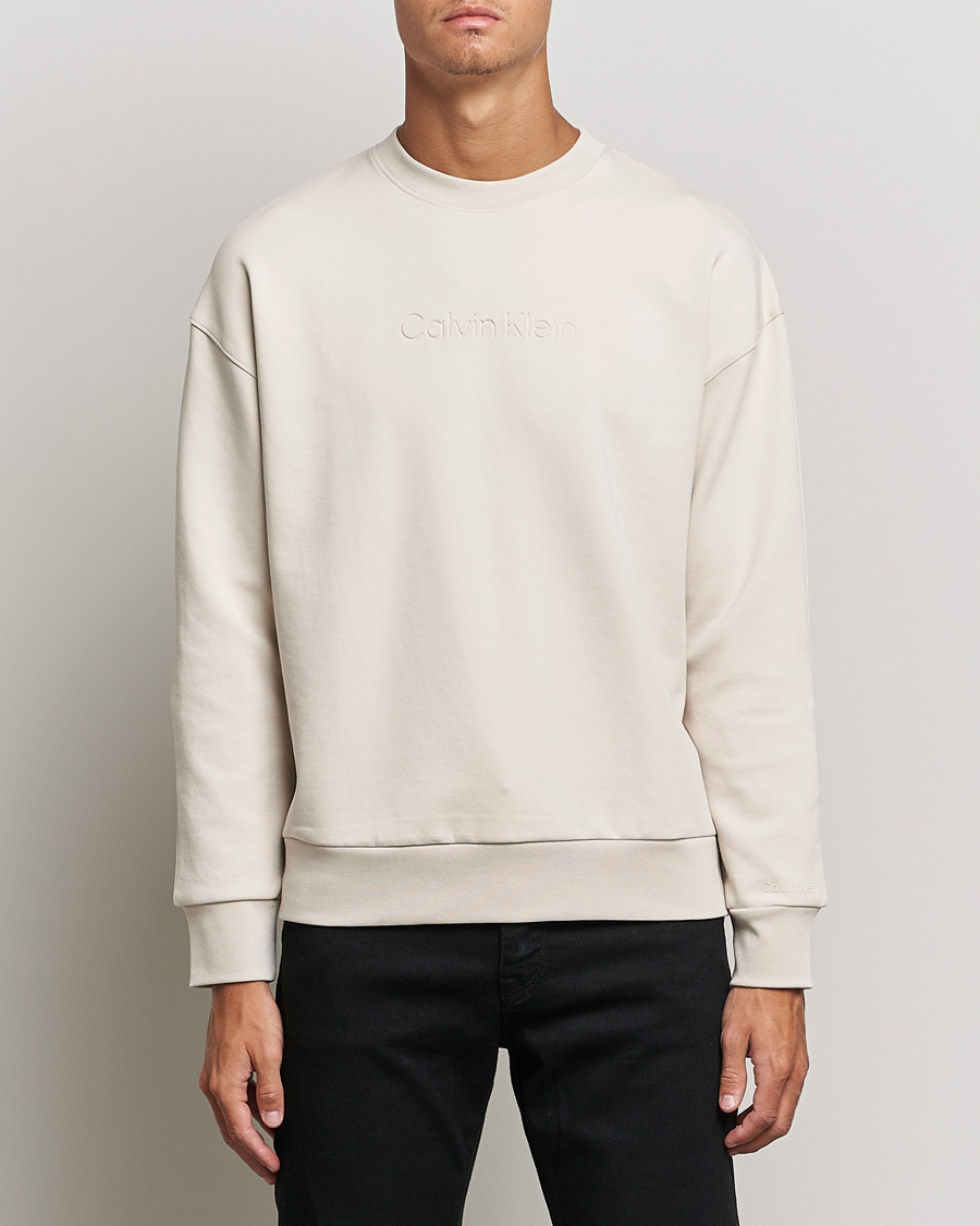 Men | Sweaters & Knitwear | Calvin Klein | Debossed Logo Crew Neck Sweatshirt Stony Beige