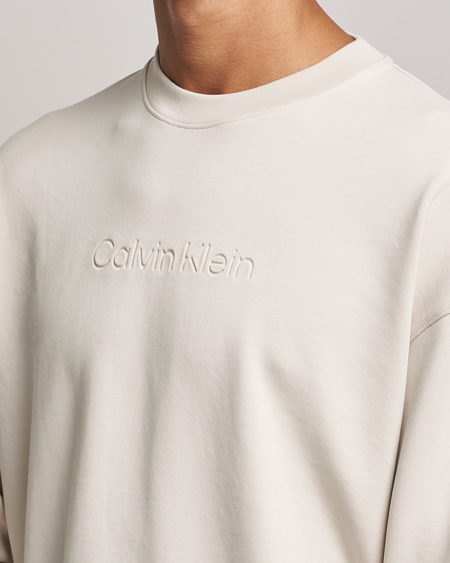 Men | Sweaters & Knitwear | Calvin Klein | Debossed Logo Crew Neck Sweatshirt Stony Beige