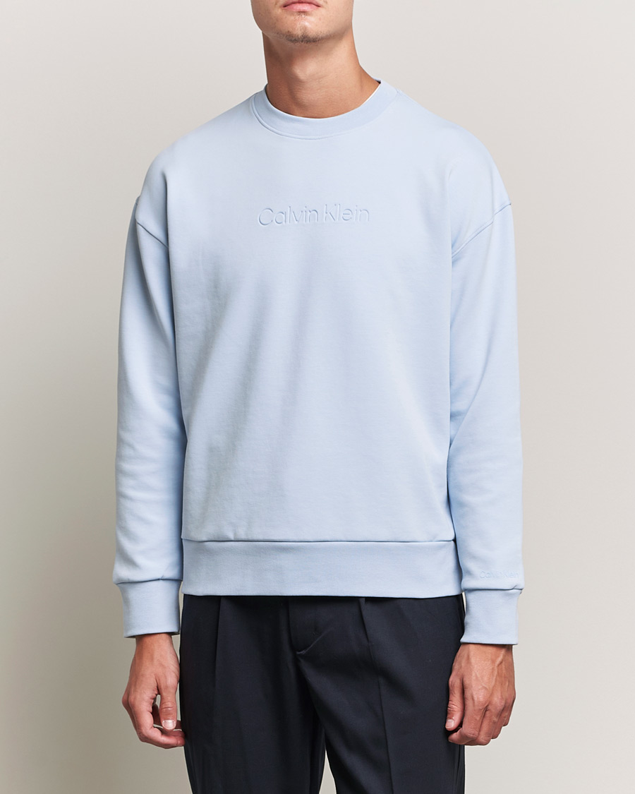 Men | Sweaters & Knitwear | Calvin Klein | Debossed Logo Crew Neck Sweatshirt Bayshore Blue