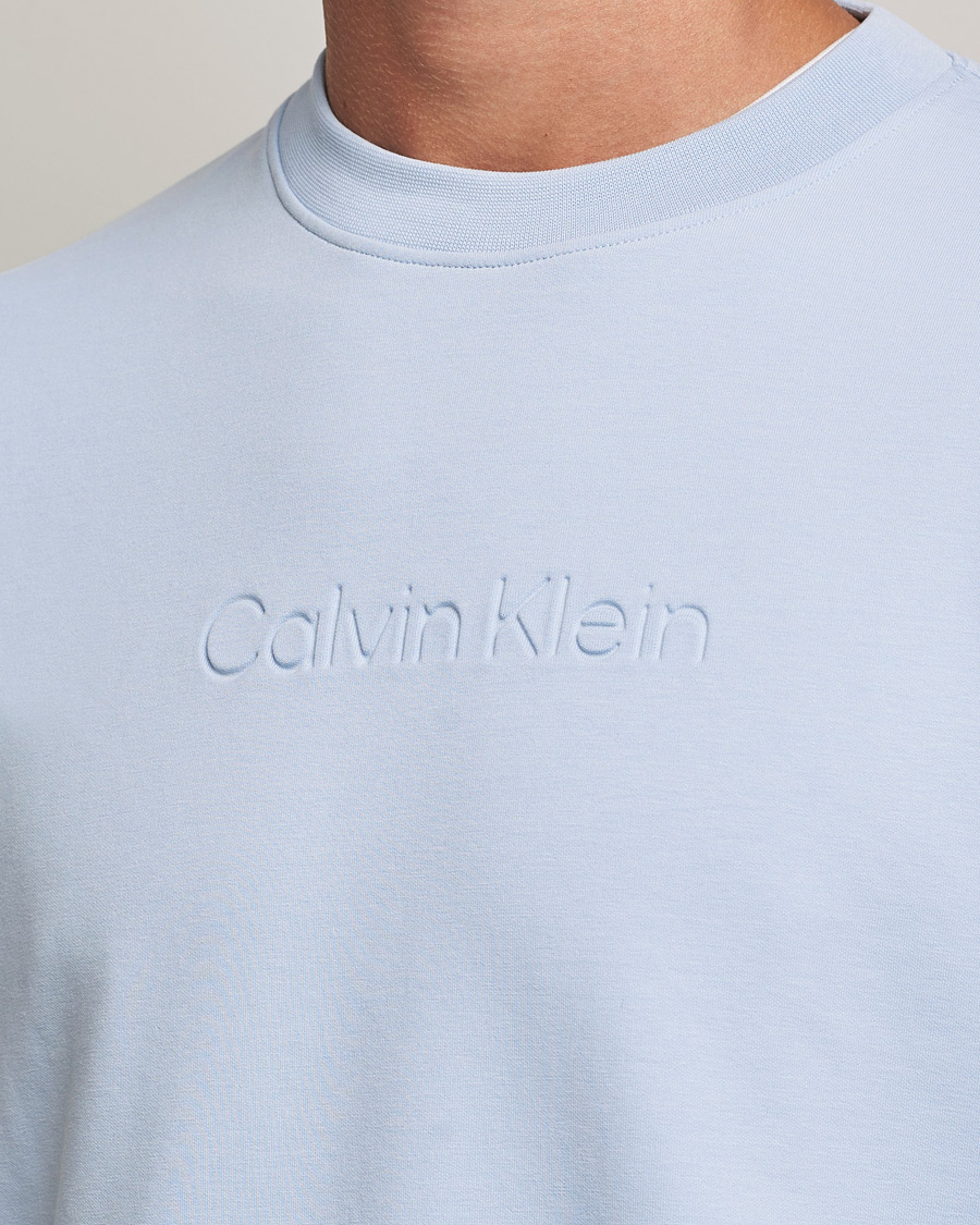 Men | Sweaters & Knitwear | Calvin Klein | Debossed Logo Crew Neck Sweatshirt Bayshore Blue