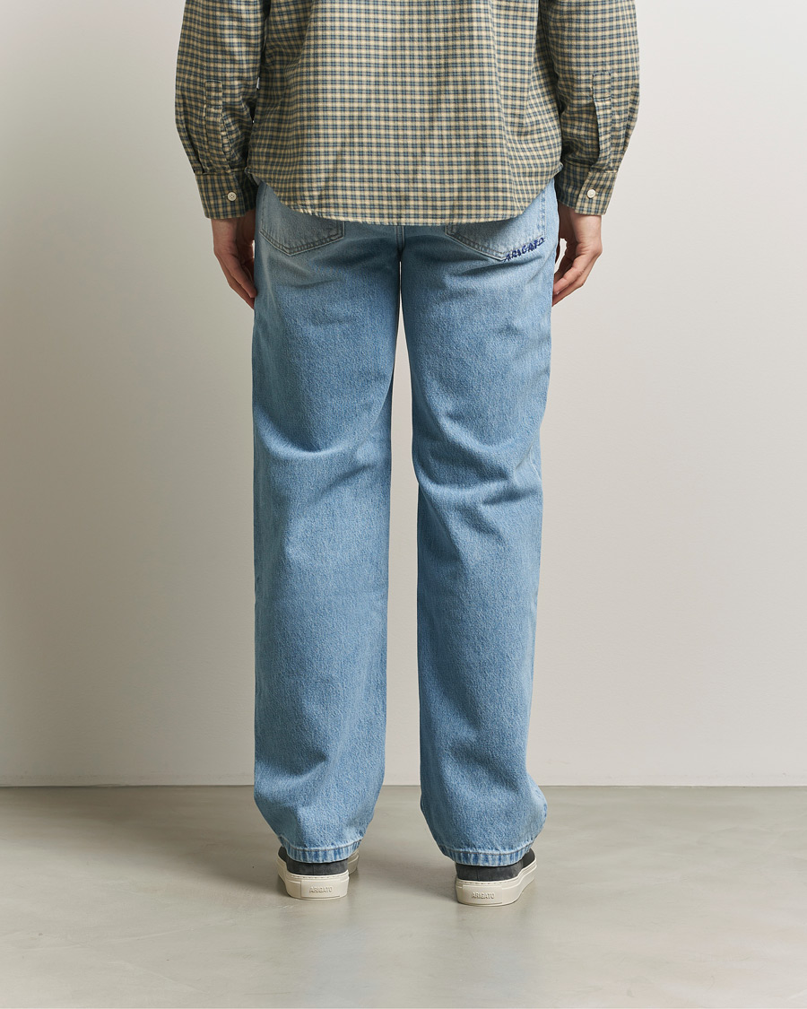 パンツ 00s Archive coating faded straight denim Axel Arigato Archive Straight Fit Jeans Light Blue at CareOfCarl.com