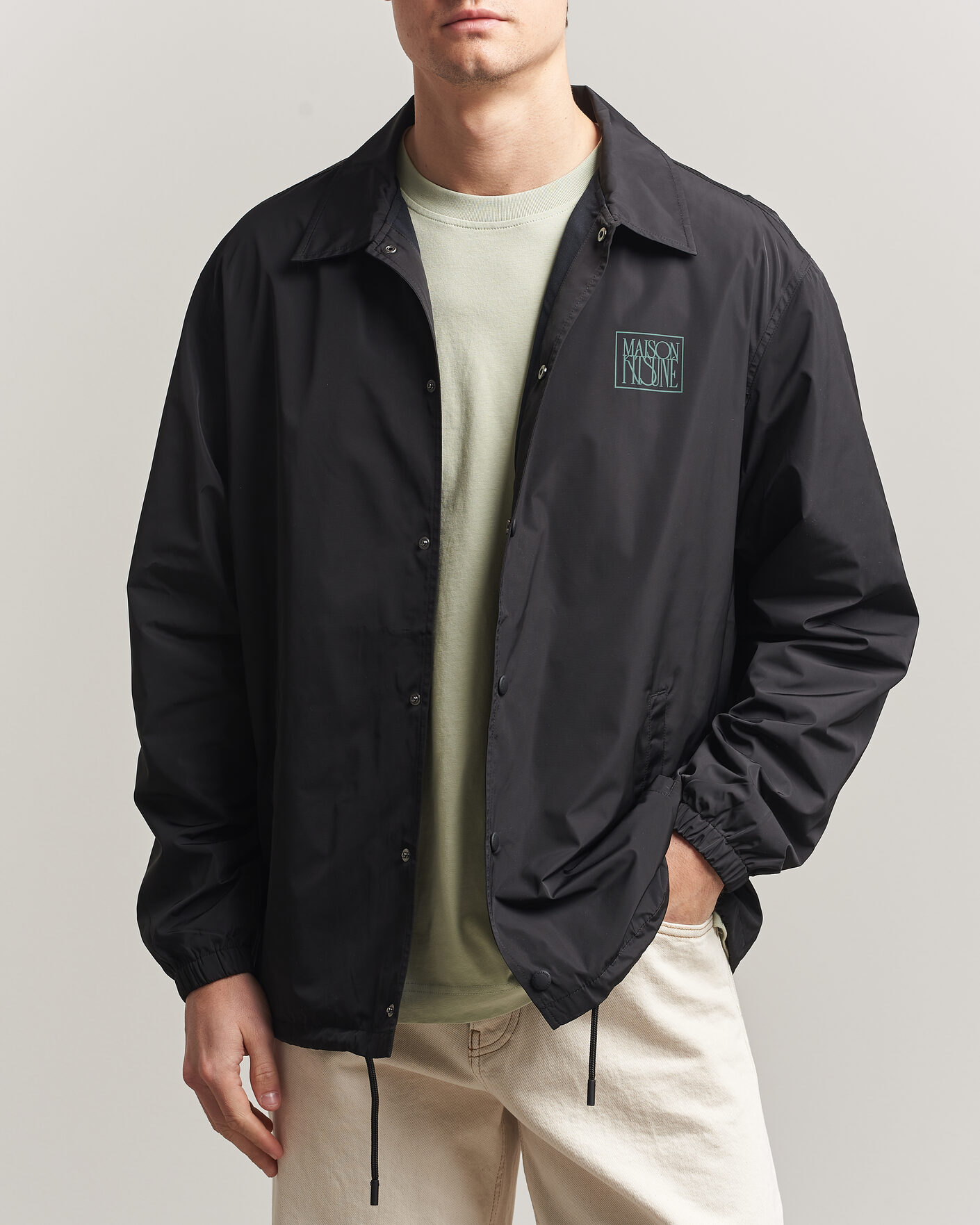 Men | Coats & Jackets | Maison Kitsuné | Tonal Fox Head Coach Jacket Black